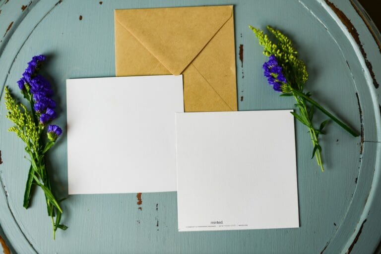 Blank wedding thank-you card with envelope and flowers, illustrating heartfelt gratitude after the wedding