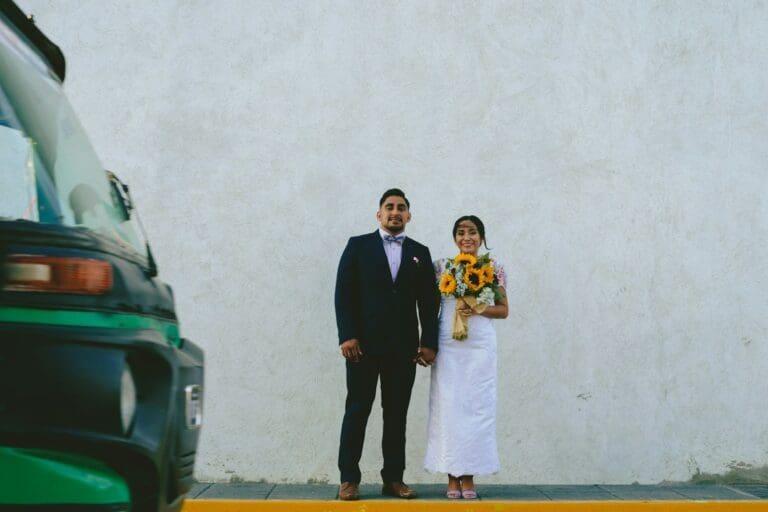 Engaged couple celebrating outdoors after planning their wedding budget