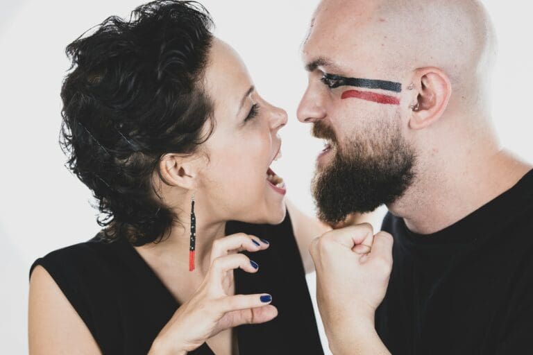 Engaged couple laughing and communicating together, illustrating healthy communication during wedding planning