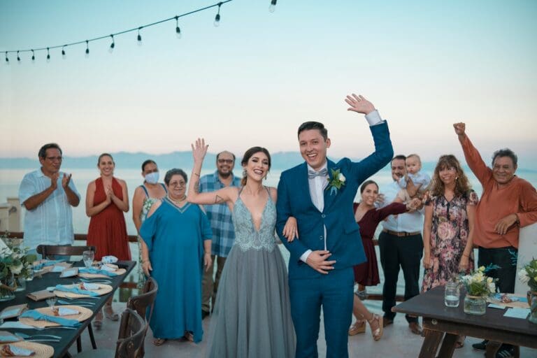 A family celebrating with the bride and groom at their outdoor wedding, representing support and togetherness during wedding planning