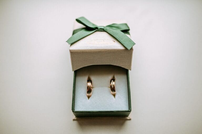 Two wedding rings on a neutral background
