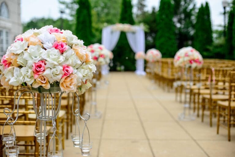 Wedding aisle with floral arrangements
